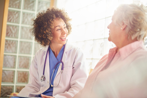 Physician talking to patient