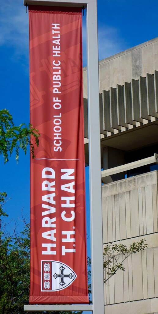 A crimson banner outside of the Harvard T.H. Chan School of Public Health
